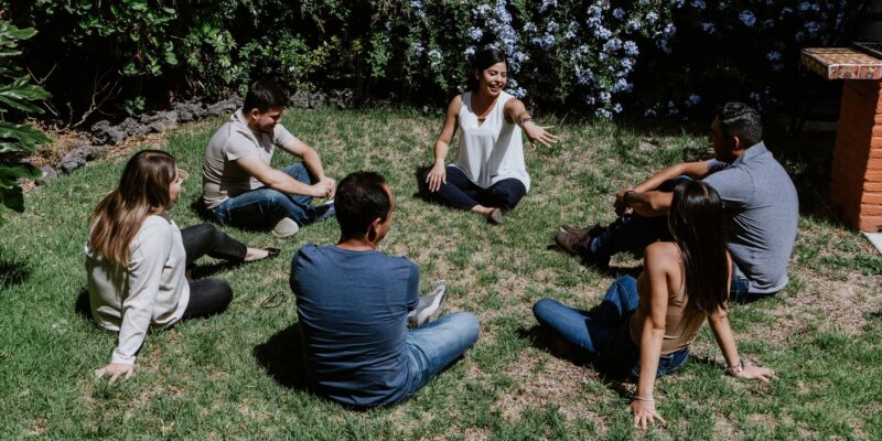 people sitting outside for a 12 step meeting