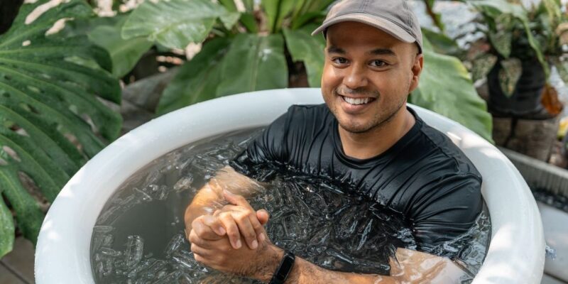 man taking a cold water plunge for mental health