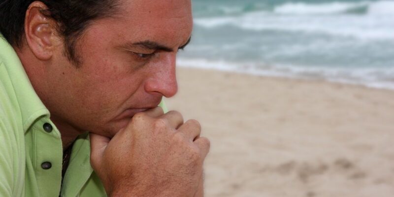 man contemplating treatment in hawaii