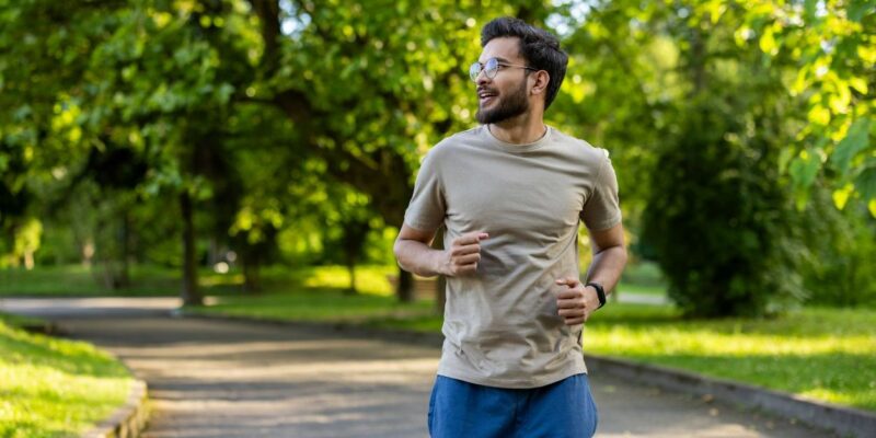 man outside running feeling good after starting addiction treatment