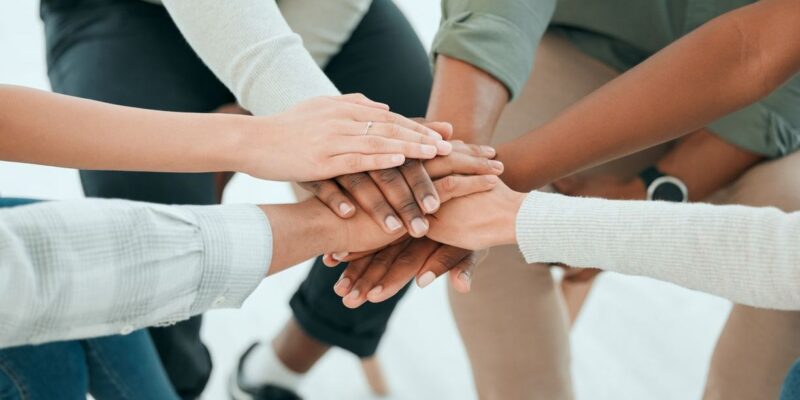 hands come together to represent community in drug use prevention